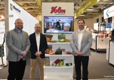 Troy Nonnenmacher, Levi Romenesko, and Wayne DeCou with Volm Companies have several different types of packaging on display.